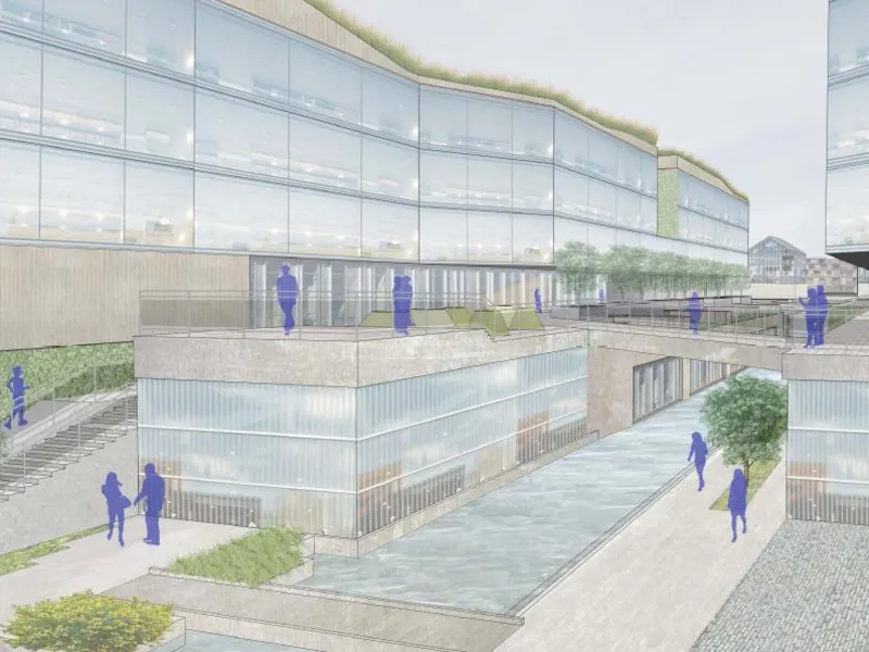 Perspective rendering of a landscaped canal walk between glass-fronted buildings in The RIBBONS