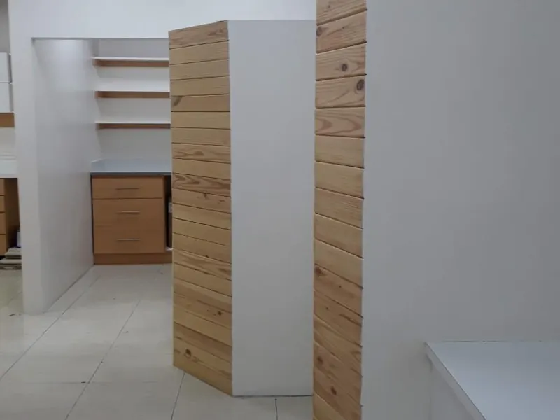 Curved timber slat partition in the WIN Dental Clinic hallway